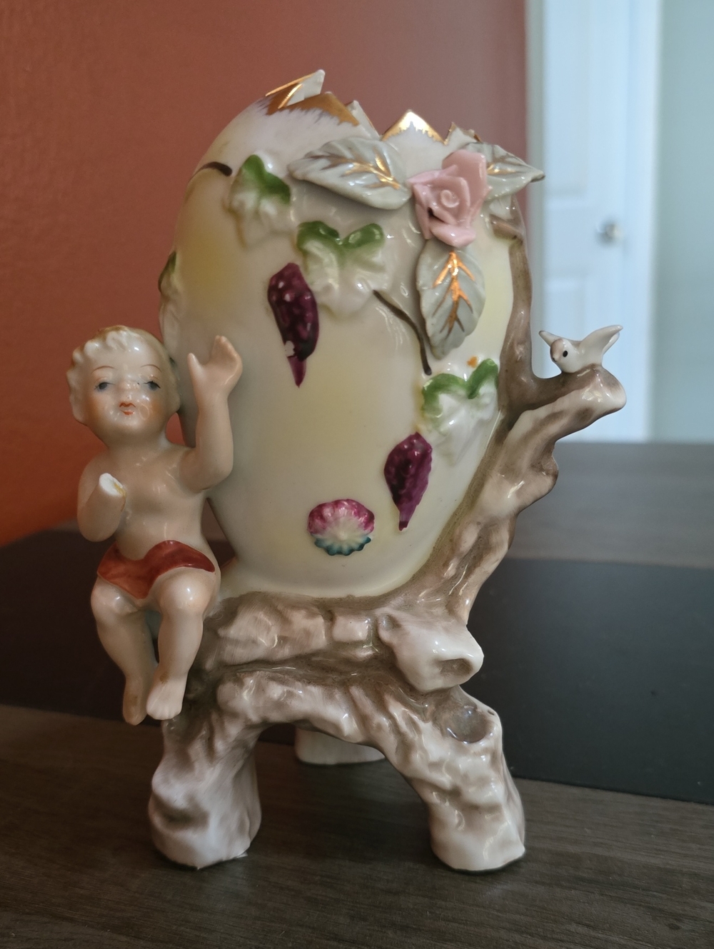 Porcelain Cherub Vase with Pink Rose Accent